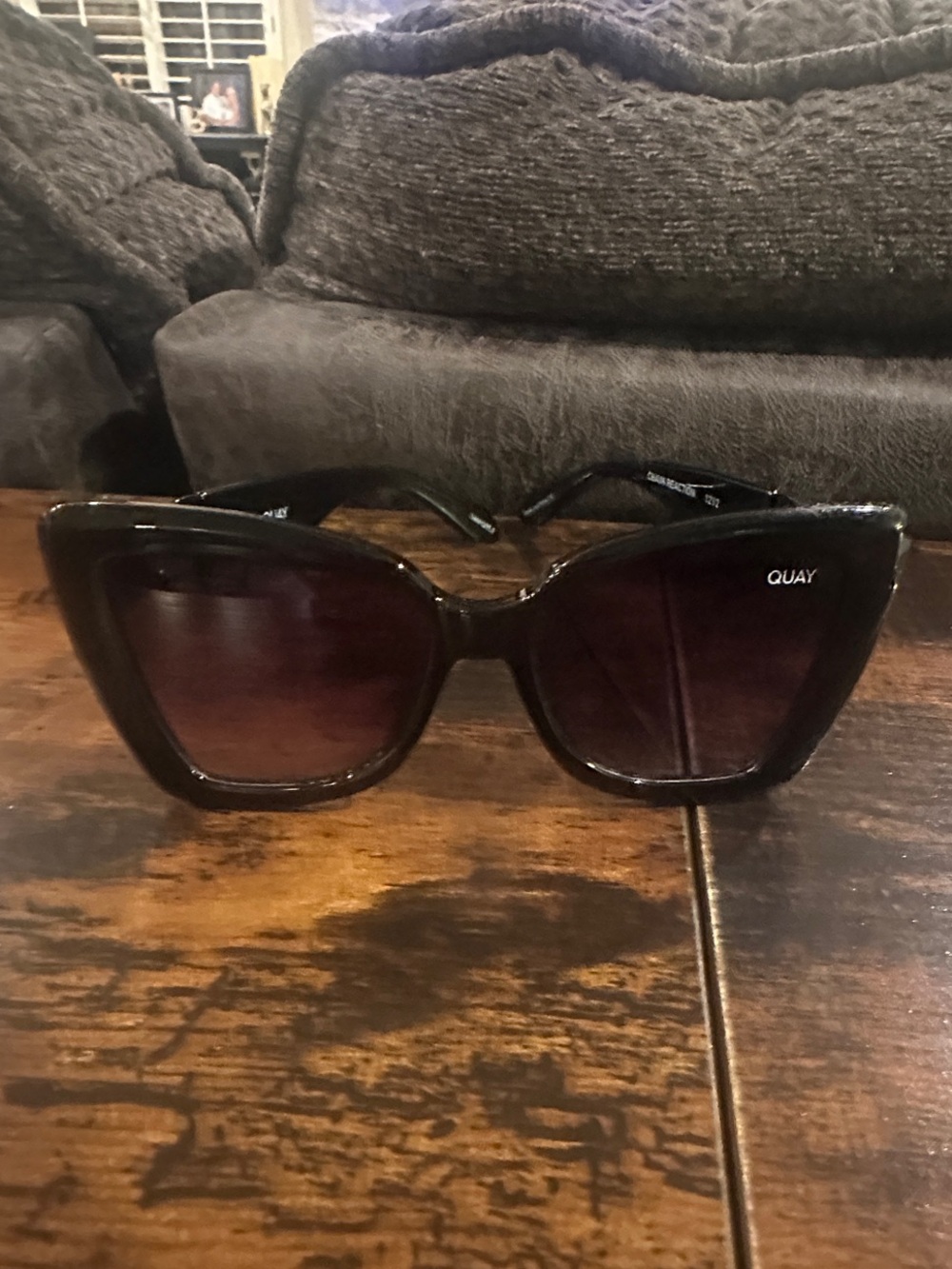 Quay Australia Black Oversized Cat-Eye Sunglasses with Gradient Brown Lenses.